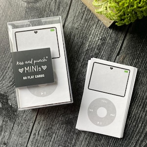 May include: White flat cards with a gray iPod design, including a screen with a heart and battery icon. The cards are packaged in a clear box, with a black label that reads "kiss and punch MINIs 60 FLAT CARDS."