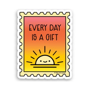 May include: A sticker with a colorful design. The sticker features a sunset illustration with a smiling sun and the text "EVERY DAY IS A GIFT". The sticker has a yellow border with a postage stamp design.