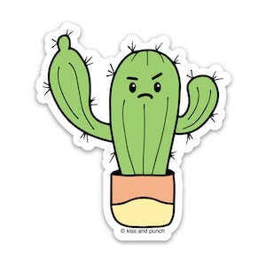 May include: A green cactus with a grumpy face and raised arm, potted in a light orange and yellow pot. The cactus is outlined in black and has a sticker-like appearance. The text "kiss and punch" is at the bottom of the sticker.
