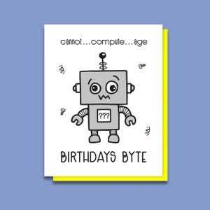 May include: A birthday card featuring a cartoon robot with the text "cannot...compute...age" and "BIRTHDAYS BYTE".