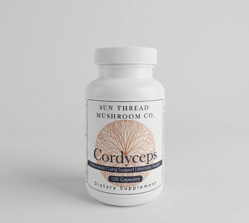 May include: A white plastic bottle of Cordyceps capsules. The label features the text "SUN THREAD MUSHROOM CO." and "Cordyceps" with the words "Endurance | Lung Support | Immune Health" below. The bottle contains 120 capsules and is a dietary supplement.