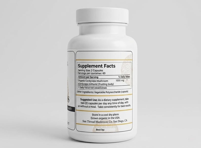 May include: A white supplement bottle with a white cap. The label displays "Supplement Facts" and details about the product, including "Organic Cordyceps Mushroom" and suggested use. The bottle is for dietary supplements.