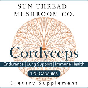 May include: A white label with the text "SUN THREAD MUSHROOM CO." and "Cordyceps" in navy blue. A brown, circular, web-like design is behind the word "Cordyceps". The label also states "Endurance | Lung Support | Immune Health" and "120 Capsules".