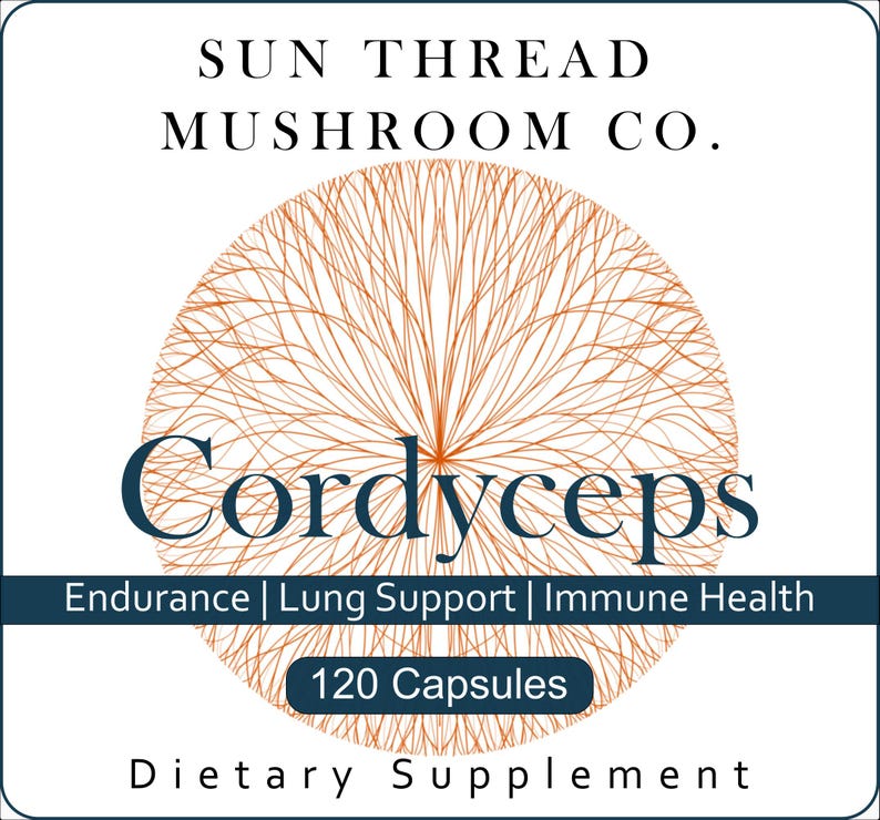 May include: A white label with the text "SUN THREAD MUSHROOM CO." and "Cordyceps" in navy blue. A brown, circular, web-like design is behind the word "Cordyceps". The label also states "Endurance | Lung Support | Immune Health" and "120 Capsules".