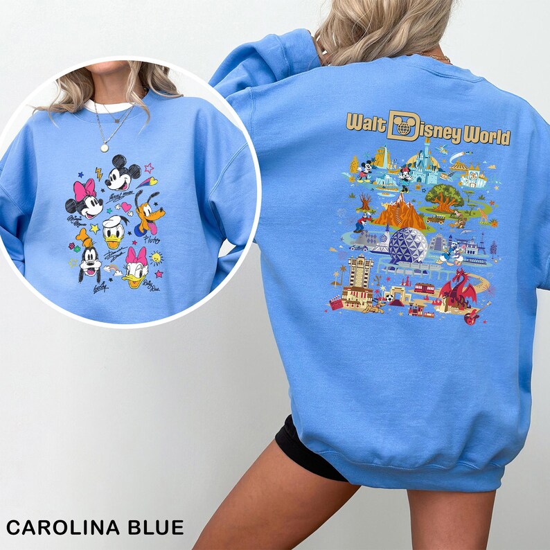 May include: Carolina blue sweatshirt with Disney characters on the front and a Walt Disney World map on the back. The front features Mickey, Minnie, Donald, Daisy, Goofy, and Pluto. The back displays various park attractions.