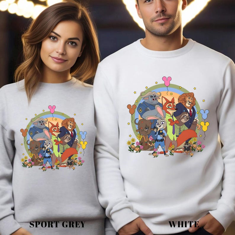 May include: Sport grey and white sweatshirts featuring a colorful cartoon graphic of animal characters. The design includes a variety of animals, flowers, and balloons. The text "SPORT GREY" and "WHITE" are printed at the bottom of the sweatshirts.