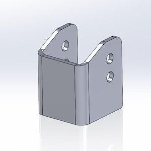 May include: A silver metal bracket with two holes on each side. The bracket is designed to be mounted to a wall or other surface.