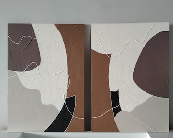 May include: Two abstract paintings with a modern minimalist design. The paintings are on canvas and feature a combination of brown, white, black, and gray colors. The paintings are textured and have a unique, organic feel.