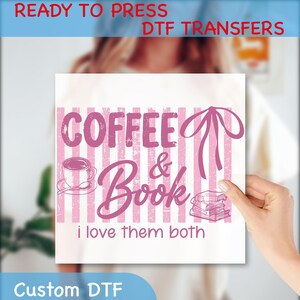 May include: A white square DTF transfer with pink text and graphics. The design includes the words "COFFEE & Book" with a coffee cup, books, and the phrase "i love them both". The words "READY TO PRESS DTF TRANSFERS" and "Custom DTF" are also present.