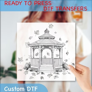 May include: Black and white DTF transfer design featuring a gazebo with falling leaves. The words "READY TO PRESS DTF TRANSFERS" and "Custom DTF" are printed on the image. The gazebo is surrounded by detailed foliage.