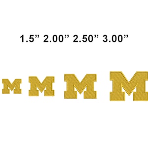 May include: Four gold embroidered letter "M" patches in varying sizes: 1.5", 2.00", 2.50", and 3.00". Each patch features a block letter design with a textured, stitched appearance. The patches are displayed against a white background.
