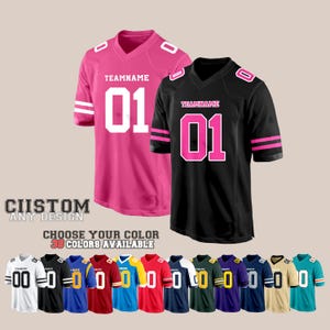 May include: Two customizable football jerseys, one pink and one black, with white numbers and pink trim. The jerseys are shown with the text "TEAMNAME 01". Below the jerseys are 12 different color options for the jerseys.