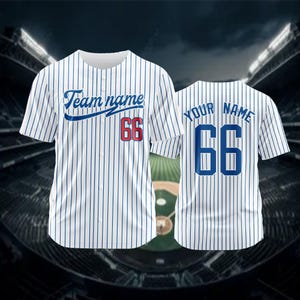 May include: White baseball jersey with blue pinstripes. The jersey has a blue and red number 66 on the front and back. The front of the jersey has the text "Team name" in blue cursive lettering.