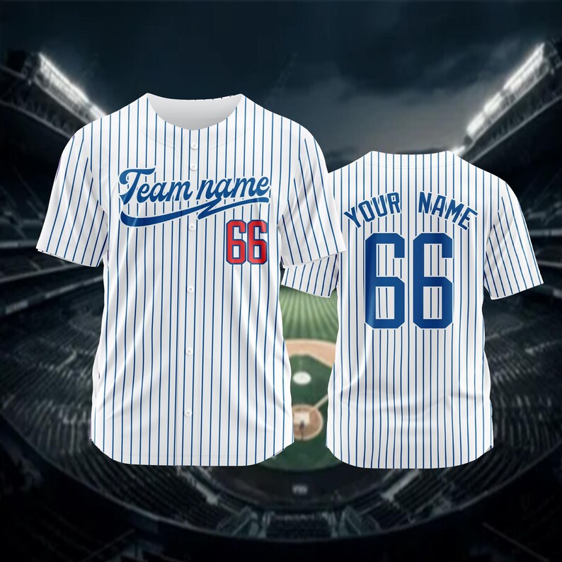 May include: White baseball jersey with blue pinstripes. The jersey has a blue and red number 66 on the front and back. The front of the jersey has the text "Team name" in blue cursive lettering.