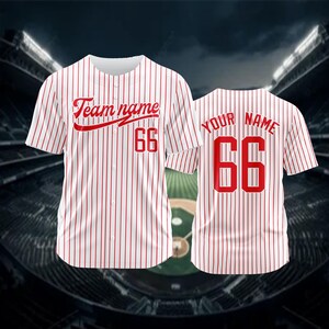 May include: White baseball jersey with red stripes and red lettering. The front of the jersey says "Team name 66" and the back says "Your name 66".