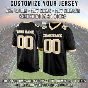 May include: Two black football jerseys with gold accents. One jersey reads "YOUR NAME" and the other reads "TEAM NAME". Both jerseys have the number "00". The text "CUSTOMIZE YOUR JERSEY" and other details are at the top and bottom of the image.