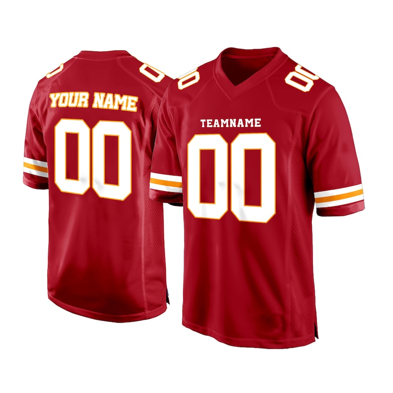 May include: Red football jersey with white and gold trim. The jersey has a white number "00" on the front and the text "TEAMNAME" above the number. The back of the jersey has a white number "00" and the text "YOUR NAME" above the number.