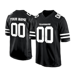 May include: Black and white football jersey with white stripes on the sleeves. The jersey has the number "00" on the front and back. The text "TEAMNAME" is above the number on the front of the jersey. The text "YOUR NAME" is above the number on the back of the jersey.