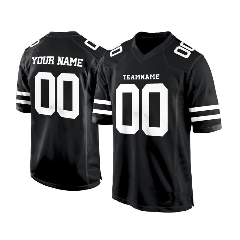 May include: Black and white football jersey with white stripes on the sleeves. The jersey has the number "00" on the front and back. The text "TEAMNAME" is above the number on the front of the jersey. The text "YOUR NAME" is above the number on the back of the jersey.