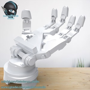 May include: A white 3D-printed robotic hand model, showcasing articulated fingers and a detailed mechanical design. The hand is mounted on a circular base. The image includes the logo of Galaxiarium 3D Studio.