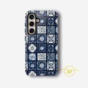 May include: A blue and white phone case with a geometric pattern. The case has a cutout for the camera lens.