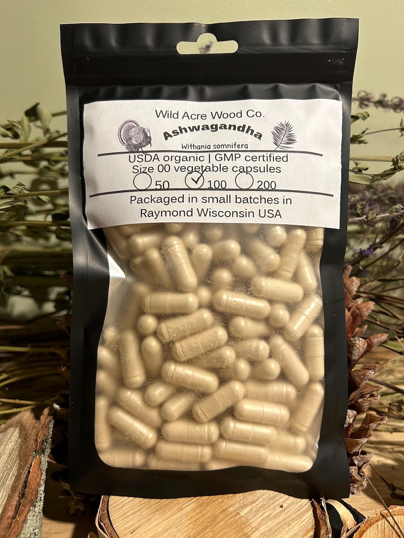 May include: A resealable bag of Ashwagandha capsules, labeled "Wild Acre Wood Co. Ashwagandha Withania somnifera USDA organic | GMP certified Size 00 vegetable capsules 50 100 200 Packaged in small batches in Raymond Wisconsin USA"