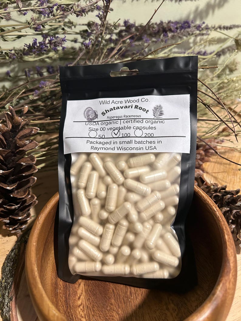 May include: A clear plastic bag filled with beige capsules labeled "Shatavari Root Asparagus Racemosus USDA organic certified organic Size 00 vegetable capsules 50 100 200 Packaged in small batches in Raymond Wisconsin USA"