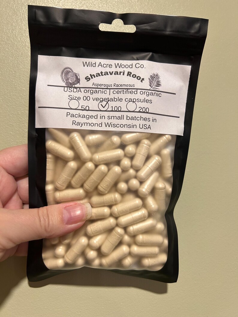 May include: A resealable bag filled with beige capsules labeled "Shatavari Root Asparagus Racemosus USDA organic | certified organic Size 00 vegetable capsules 50 100 200 Packaged in small batches in Raymond Wisconsin USA"