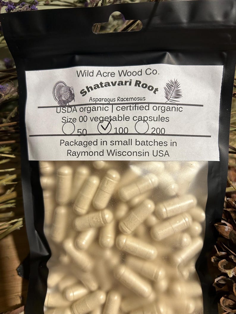 May include: A resealable plastic bag filled with beige capsules labeled "Shatavari Root Asparagus Racemosus USDA organic | certified organic Size 00 vegetable capsules 50 100 200 Packaged in small batches in Raymond Wisconsin USA"