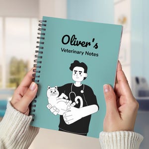 May include: A teal spiral-bound notebook with the text "Oliver's Veterinary Notes" and an illustration of a veterinarian holding a cat. The notebook's cover features a black and white illustration of a veterinarian with a stethoscope and a white cat.