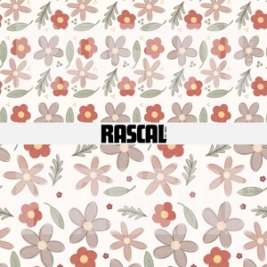 May include: Floral pattern featuring repeating flowers in shades of red, brown, and gray, with green leaves on a cream background. The word "RASCAL" is printed in bold black letters.