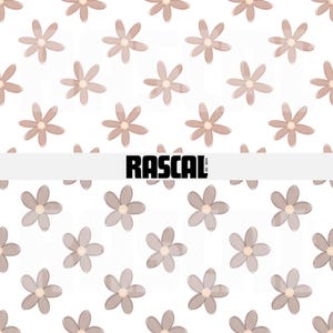 May include: A repeating pattern of light brown flowers with a white background. The flowers have a simple, stylized design. The word "RASCAL" is displayed in bold, black letters across the center of the image.