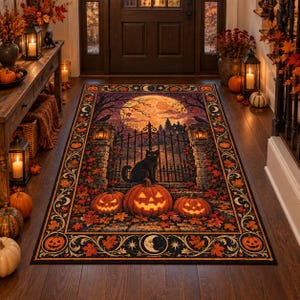 May include: A rectangular area rug featuring a Halloween scene with a black cat sitting before an iron gate, three glowing jack-o'-lanterns, and a large full moon. The border is decorated with orange autumn leaves, crescent moons, and pumpkins.