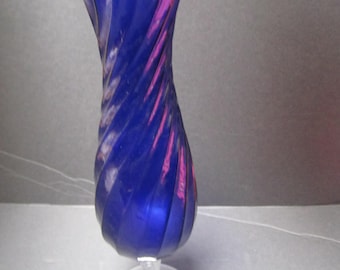 Vintage Colbalt blue swirl pattered National potteries company with foil seal.