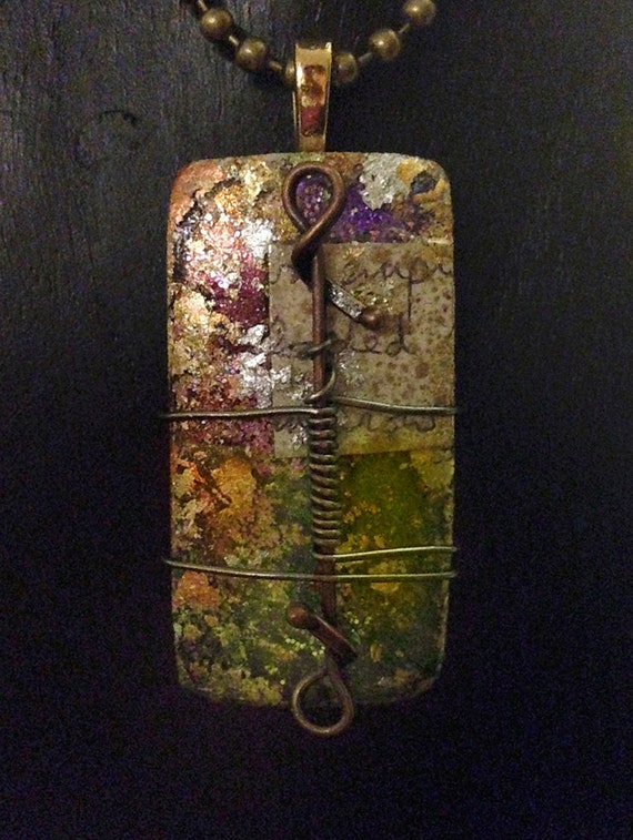 Fusion glass collage pendant.