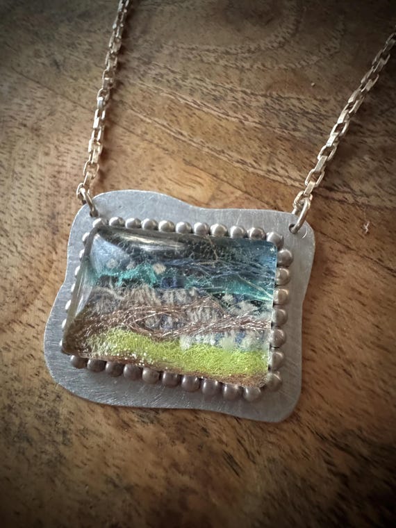 Fiber Art Pendant Necklace entitled "Riverside" (created using recycled fiber art scraps)