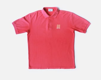 Polo de Inglaterra de los años 80, desteñido por el sol. Talla L/M.