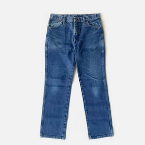 May include: A pair of blue denim jeans with a classic five-pocket design. The jeans have a straight leg cut and a button and zip closure. The denim has a faded appearance, suggesting wear. The jeans are displayed on a white background.