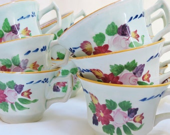 A Dozen Calyx Ware Cups and Saucers