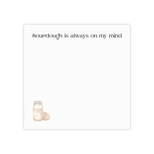 May include: A white card with the text "Sourdough is always on my mind" in black script font. A watercolour illustration of a glass jar with sourdough starter and a loaf of sourdough bread is in the bottom left corner.