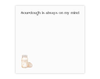 May include: A white card with the text "Sourdough is always on my mind" in black script font. A watercolor illustration of a glass jar with sourdough starter and a loaf of sourdough bread is in the bottom left corner.