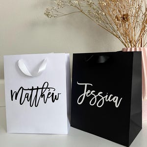 custom gift bags, personalized gift bags, luxury gift bags, wedding gift bags, bridesmaid gift bags, personalized bridesmaid gift bags, bachelorette party bag, bridal party gift bag, thank you gift bags, elegant gift bag, custom bag gift, bulk gift bags, bulk custom gift bags, business gift bags, custom gift bag sets, mini custom gift bag, baby shower gift bag, bridal shower gift bag, birthday gift bag, graduation gift bag, anniversary gift bag, small business logo gift bags,