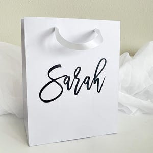 custom gift bags, personalized gift bags, luxury gift bags, wedding gift bags, bridesmaid gift bags, personalized bridesmaid gift bags, bachelorette party bag, bridal party gift bag, thank you gift bags, elegant gift bag, custom bag gift, bulk gift bags, bulk custom gift bags, business gift bags, custom gift bag sets, mini custom gift bag, baby shower gift bag, bridal shower gift bag, birthday gift bag, graduation gift bag, anniversary gift bag, small business logo gift bags,