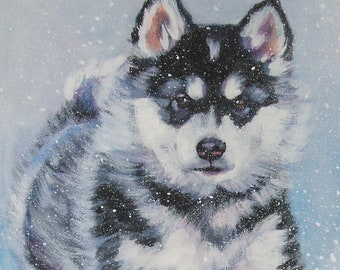 May include: An oil painting of a husky puppy running in the snow. The puppy has black and white fur with a pink nose and is surrounded by falling snowflakes. The artist's signature, "L.A. SHEPARD ART", is visible in the bottom right corner.