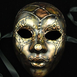 Riveted Mask, Full faced harlequin style mask with various metal gildings and 3D raised jester/clown design
