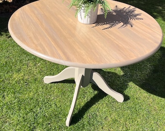 Adjustable round kitchen/ dining table, expertly finished in a contemporary neutral shade
