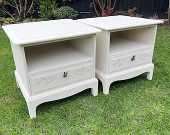 A pair of original Stag bedside cabinets, finished in a soft light neutral paint