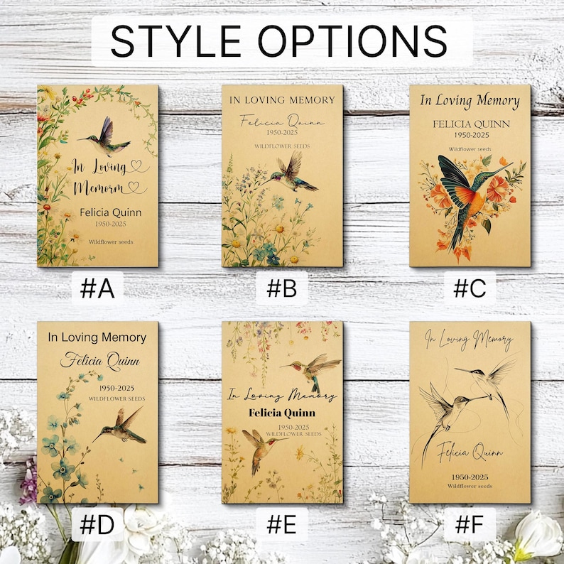 May include: Six rectangular memorial seed packets labelled STYLE OPTIONS, each featuring a tan background, hummingbird illustrations, and the text In Loving Memory, Felicia Quinn, 1950-2025, and Wildflower seeds, labelled A through F respectively.