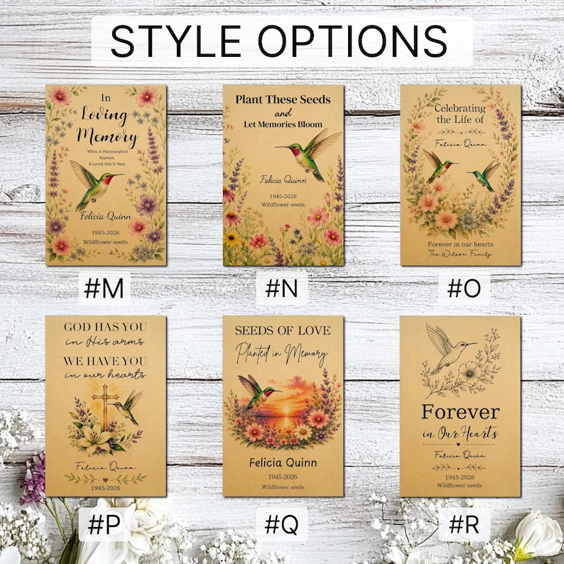 May include: Six rectangular memorial seed packet designs on kraft paper, labelled #M through #R. Each features hummingbird illustrations, floral motifs, and personalised text like In Loving Memory, Plant These Seeds, and Forever in Our Hearts.
