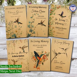 May include: Six rectangular kraft paper packets labelled In Loving Memory, Felicia Quinn, 1950-2025, and Wildflower Seeds. Each packet features botanical illustrations of wildflowers and hummingbirds in various artistic styles and colour palettes.